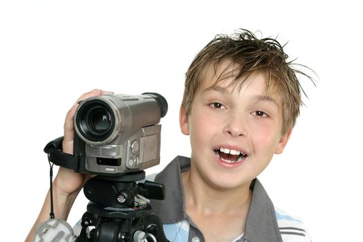 A child using a video camera and tripod