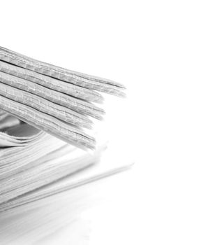 pile of news papers on white background