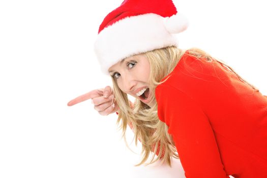 A surprised or delighted female wearing a festive santa hat points to your Christmas message, slogan or product.