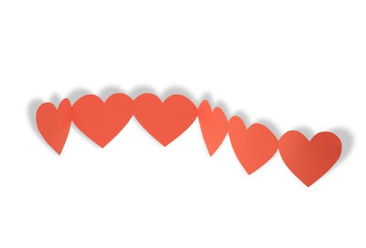 Chain made from cutting paper red hearts isolated on white background with clipping path