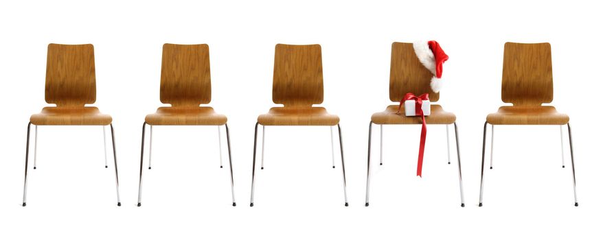 Chairs in a row with gift on white background