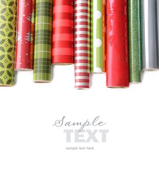 Rolls of colored wrapping  paper on white background
