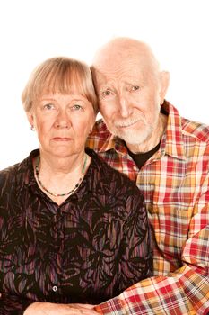 Portrait of concerned senior couple on white background