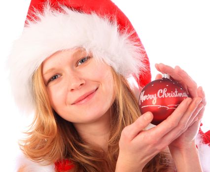 smiling Miss Santa is holding a red christmas tree ball - "Merry Christmas" is written on the ball