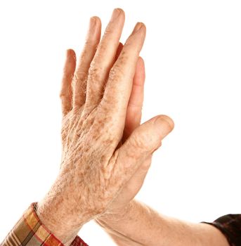male and female senior hands together on white background