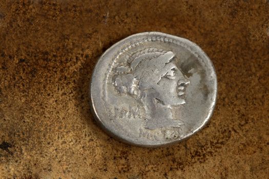 M. Porcius Cato  Rome.   Front side of Roman Republic (200-30bc) silver coin AR denarius (89bc) depicting female draped hair taken in chignon.  Behind the nape of the neck, ROMA, Under the neck, M.Cato.  From the time of Caesar,   Issuance of coinage was administered by annuallly elected magistrates (moneyers).  A period of internal conflicts.  The era of Julius Caesar, Marc Antony, Brutus.