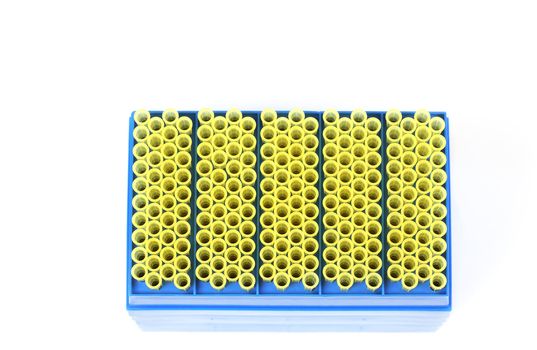 Top view of a rack of yellow pipet tips