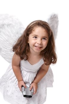 Cheeky angel fairy wearing a white dress with silver embroidery and feathered wings.  She is holding binoculars.