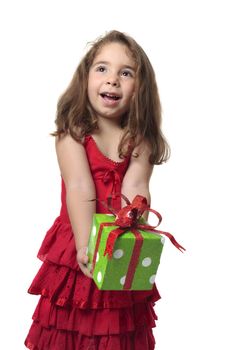 Young happy child holding a present with gleeful smile