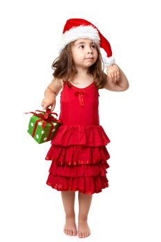 Little girl wearing a red dress carries a present