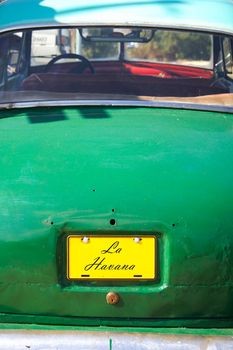 Symbol of cuba with la havana written on the license plate of the car.