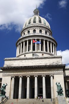 capitol of Cuba with the cuban flag in La Havana on a summer day.