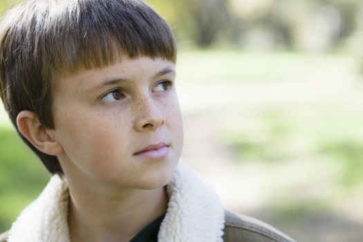 Portrait of a Cute Young Boy Looking Away From Camera