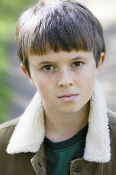 Portrait of a Cute Young Boy Looking Directly To Camera