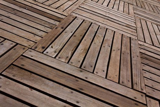 Patterns and textures of a wooden planks pavement