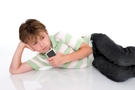 A child relaxes with a portable digital mp3 player