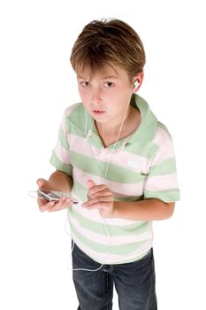 A child dressed in jeans and polo shirt holding an mp3 player.