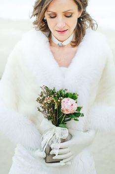 beautiful young bride with a wedding bouquet