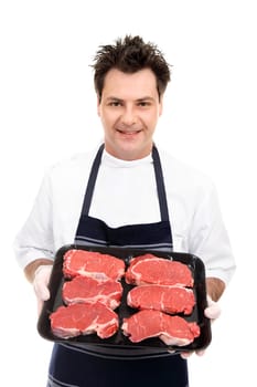 Butcher preparing trays of meat 