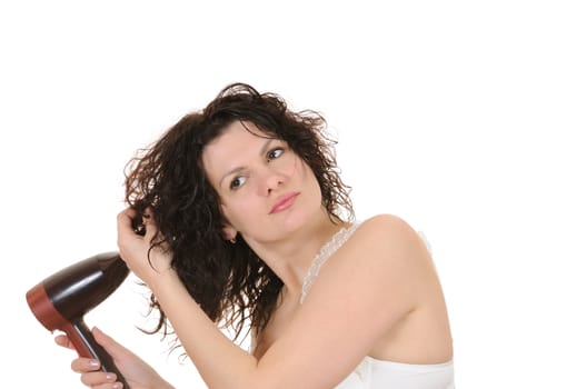 The woman dries the hair dryer hair