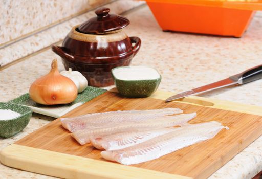 Meal preparation on kitchen from a fish