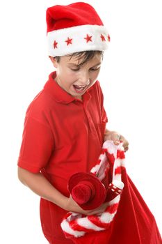 A child opens up a santa sack at Christmas time.