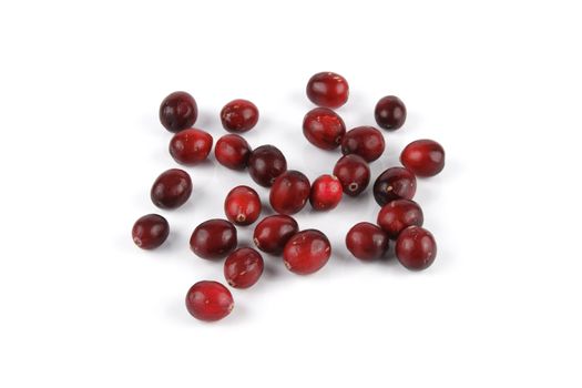 Red ripe juicy cranberries on a reflective white background