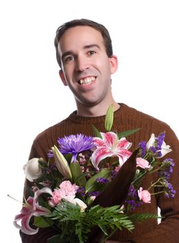 A smiling male florist is holding a lily bouquet, isolated against a white background