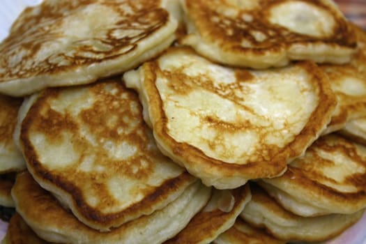 For a breakfast the big heap of a fritters is prepared. They very tasty.