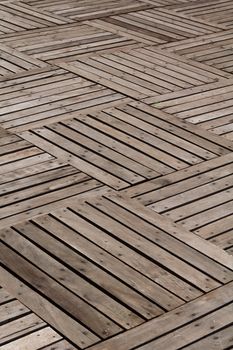 Patterns and textures of a wooden planks pavement