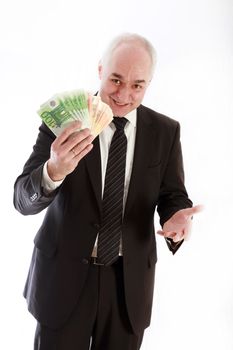 Friendly man with euro notes in his hand. He wears a black suit and smiling at the camera.