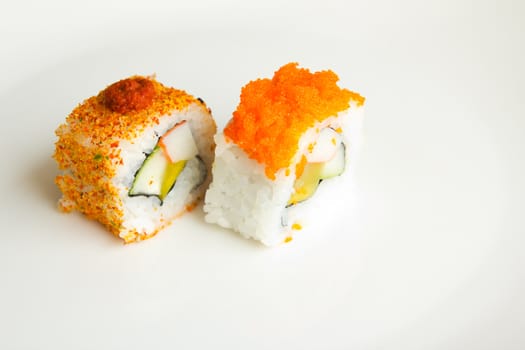 Two Japanese sushi isolated on a white plate