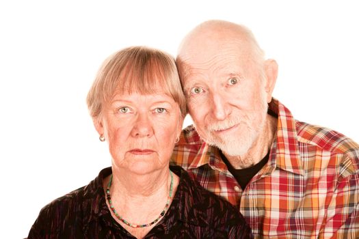 Portrait of concerned senior couple on white background