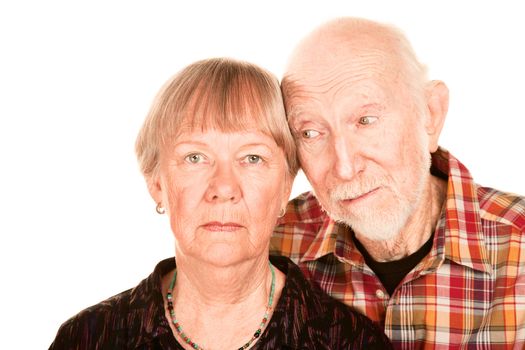 Portrait of concerned senior couple on white background