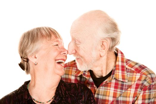 Smiling senior couple touching their noses together