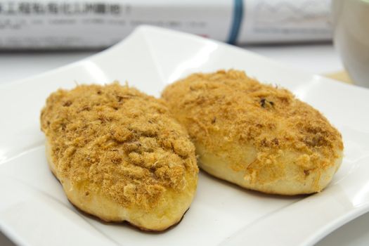 Two chicken floss buns served in a white plate