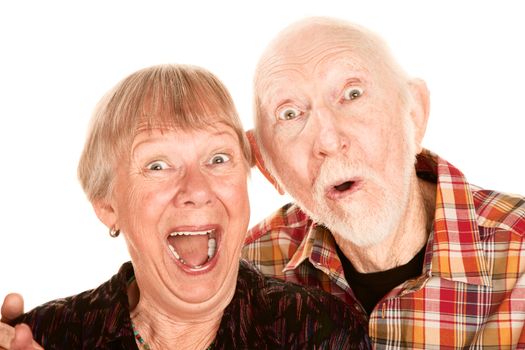 Senior couple with surprised and happy expressions
