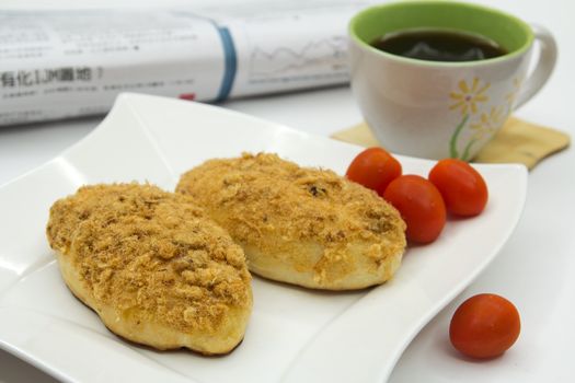 healthy breakfast chicken floss bun with cup of coffee and tomato