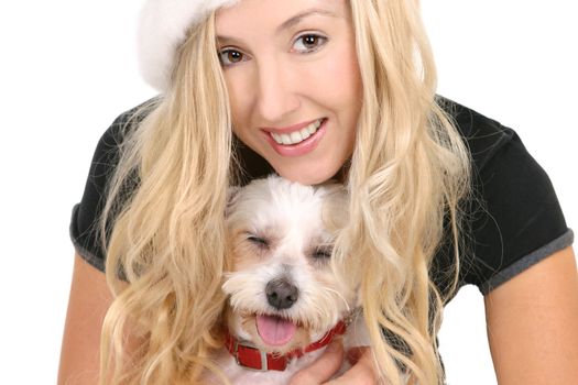 Happy female cuddling a small white maltese terrier
