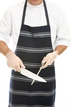 A butcher using a butcher steel to shapren a knife