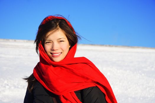 Beautiful winter woman with red headscarf.