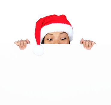 Christmas woman with sign. Very beautiful mixed race asian / caucasian woman with billboard looking surprised down at the sign. Isolated on white background.