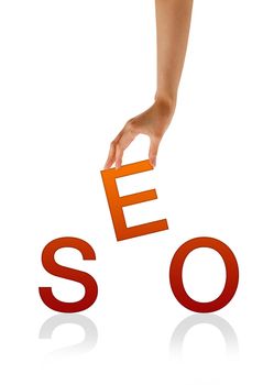 High resolution graphic of a hand holding the letter E from the word SEO.