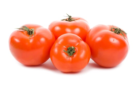 four red ripe tomatoes, isolated on white