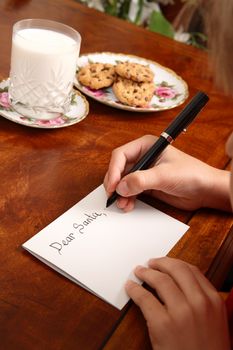 A child writing a letter to Santa