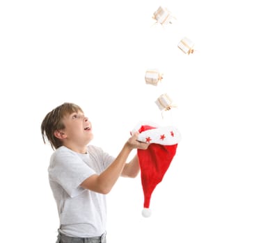 Boy looking up is catching falling Christmas presents 