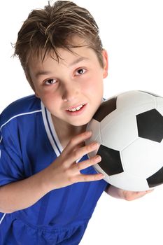 Boy holding a soccer ball ready to play