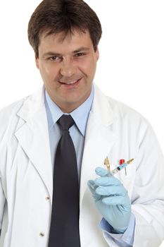 Smiling medical practitioner holding a syringe needle filled with medication, vaccination or other drug.