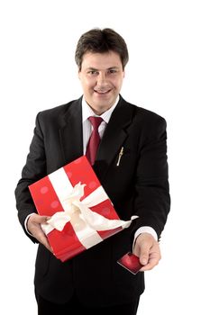 A man buys a  present with a gift card or credit debit card.  Focus to man, shallow dof.
