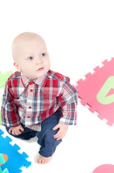 Studio shot of little boy, isolated on white